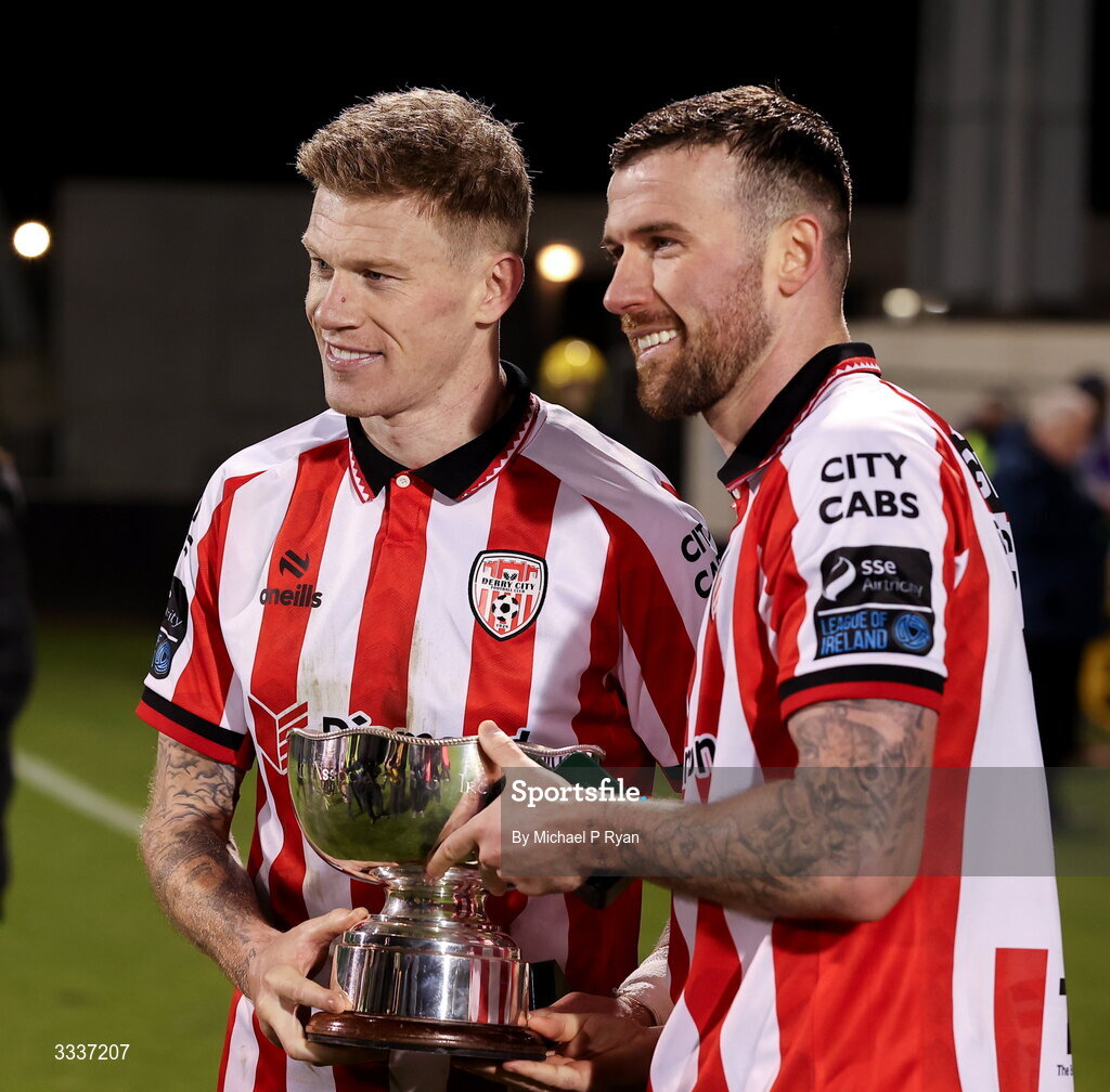 31 January 2026; Derry City players James McClean, left, and Patrick McClean celebrate with the President's Cup after the 2026 Men's President's Cup final match between Shamrock Rovers and Derry City at Tallaght Stadium in Dublin. Photo by Michael P Ryan/Sportsfile