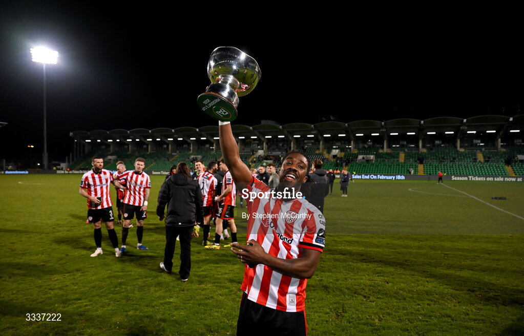 31 January 2026; Kevin dos Santos of Derry City celebrates with the FAI President's Cup after victory in the 2026 Men's President's Cup final match between Shamrock Rovers and Derry City at Tallaght Stadium in Dublin. Photo by Stephen McCarthy/Sportsfile