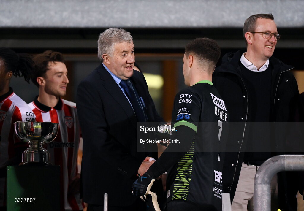 31 January 2026; FAI President Paul Cooke shakes hands with Derry City goalkeeper Brian Maher during the 2026 Men's President's Cup final match between Shamrock Rovers and Derry City at Tallaght Stadium in Dublin. Photo by Stephen McCarthy/Sportsfile