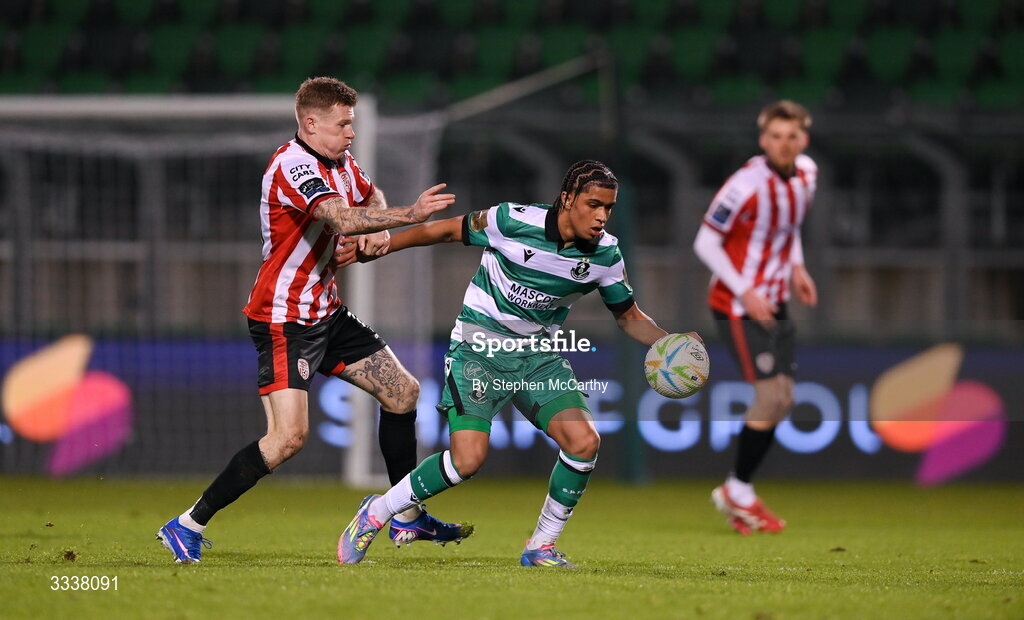 31 January 2026; Victor Ozhianvuna of Shamrock Rovers in action against James McClean of Derry City during the 2026 Men's President's Cup final match between Shamrock Rovers and Derry City at Tallaght Stadium in Dublin. Photo by Stephen McCarthy/Sportsfile