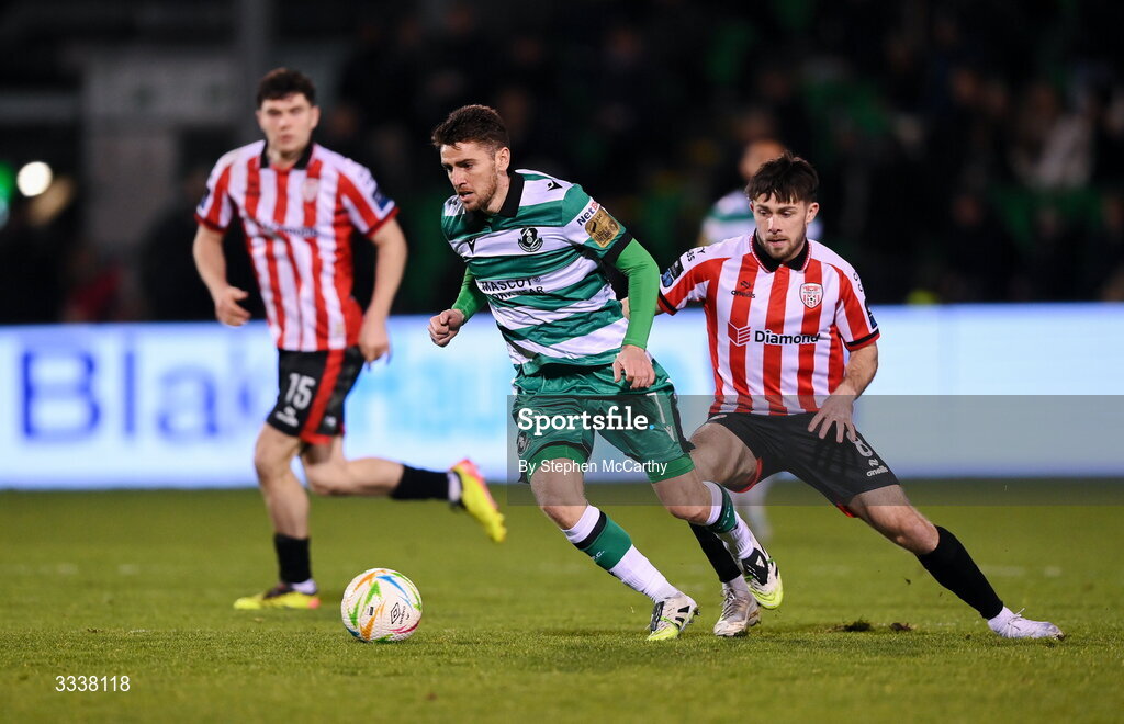 31 January 2026; Dylan Watts of Shamrock Rovers in action against Adam O'Reilly of Derry City during the 2026 Men's President's Cup final match between Shamrock Rovers and Derry City at Tallaght Stadium in Dublin. Photo by Stephen McCarthy/Sportsfile
