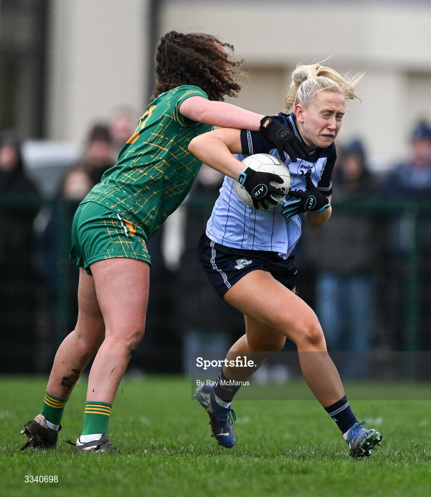 2 February 2026; Jodi Egan of Dublin is tackled by`Emma Duggan of Meath during the Lidl Ladies National Football League Division 1 Round 2 match between Meath and Dublin at St Patrick’s GFC in Stamullen, Meath. Photo by Ray McManus/Sportsfile