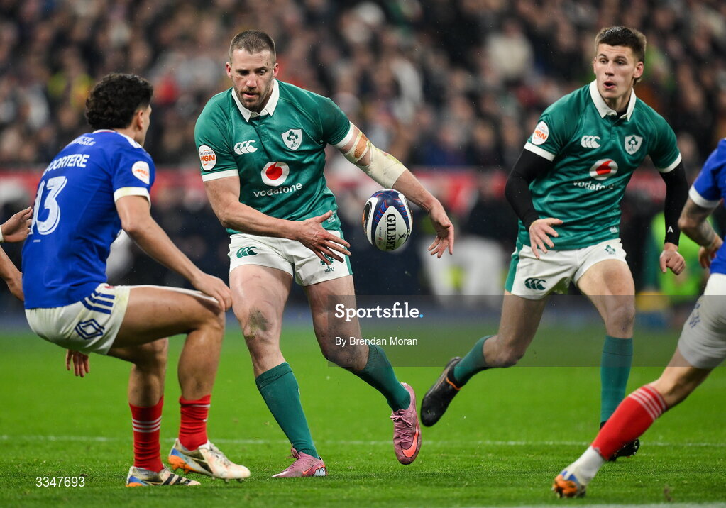 5 February 2026; Stuart McCloskey of Ireland offloads to Sam Prendergast during the Guinness 6 Nations Rugby Championship match between France and Ireland at Stade de France in Paris, France. Photo by Brendan Moran/Sportsfile