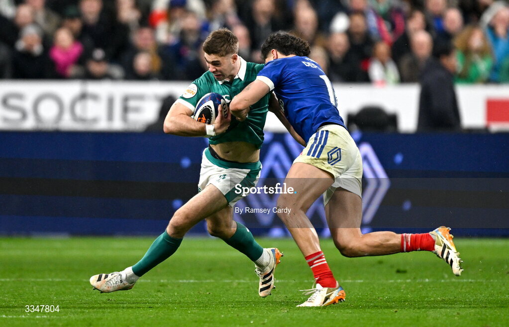 5 February 2026; Jack Crowley of Ireland is tackled by Nicolas Depoortère of France during the Guinness 6 Nations Rugby Championship match between France and Ireland at Stade de France in Paris, France. Photo by Ramsey Cardy/Sportsfile