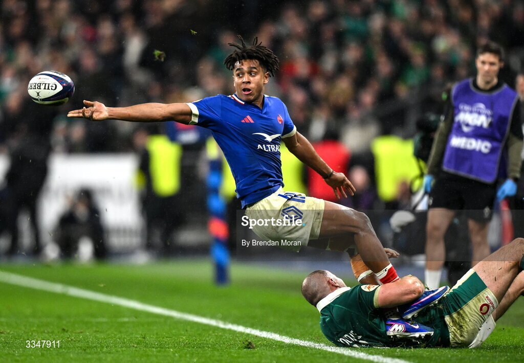 5 February 2026; Théo Attissogbe of France is tackled by Jacob Stockdale of Ireland during the Guinness 6 Nations Rugby Championship match between France and Ireland at Stade de France in Paris, France. Photo by Brendan Moran/Sportsfile