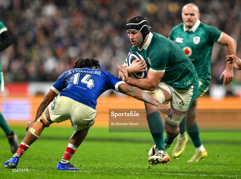5 February 2026; Caelan Doris of Ireland is tackled by Théo Attissogbe of France during the Guinness 6 Nations Rugby Championship match between France and Ireland at Stade de France in Paris, France. Photo by Brendan Moran/Sportsfile