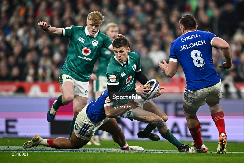 5 February 2026; Sam Prendergast of Ireland is tackled by Yoram Moefana of France during the Guinness 6 Nations Rugby Championship match between France and Ireland at Stade de France in Paris, France. Photo by Seb Daly/Sportsfile