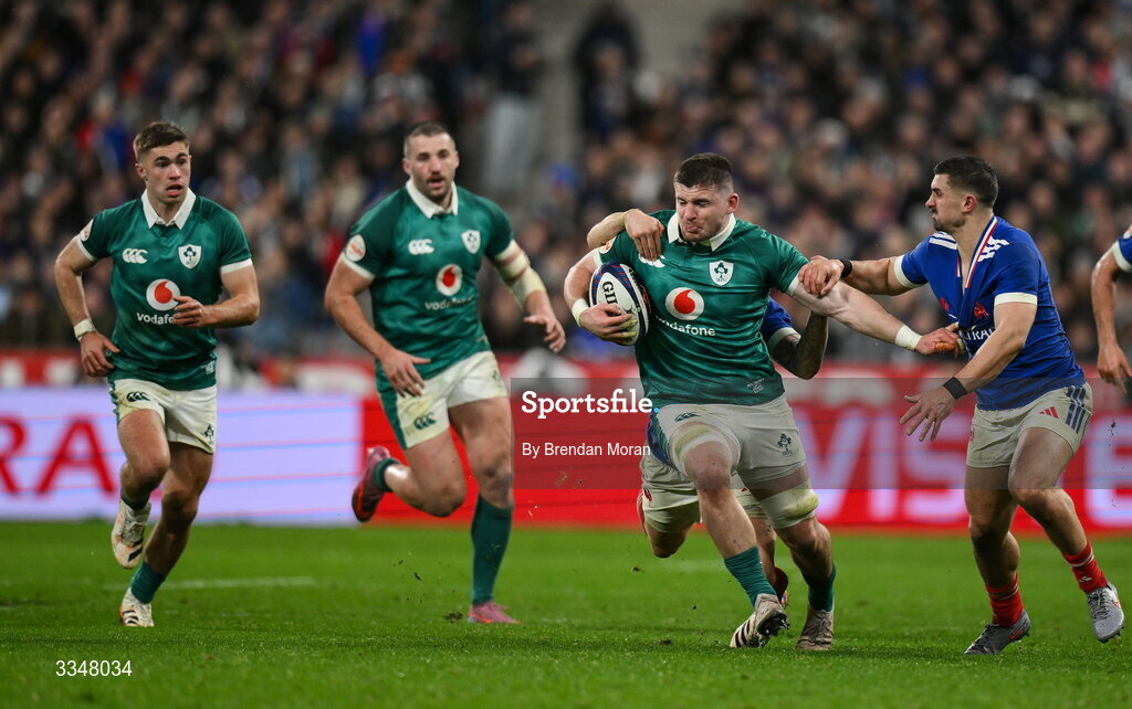 5 February 2026; Nick Timoney of Ireland is tackled by Matthieu Jalibert and Thomas Ramos of France during the Guinness 6 Nations Rugby Championship match between France and Ireland at Stade de France in Paris, France. Photo by Brendan Moran/Sportsfile