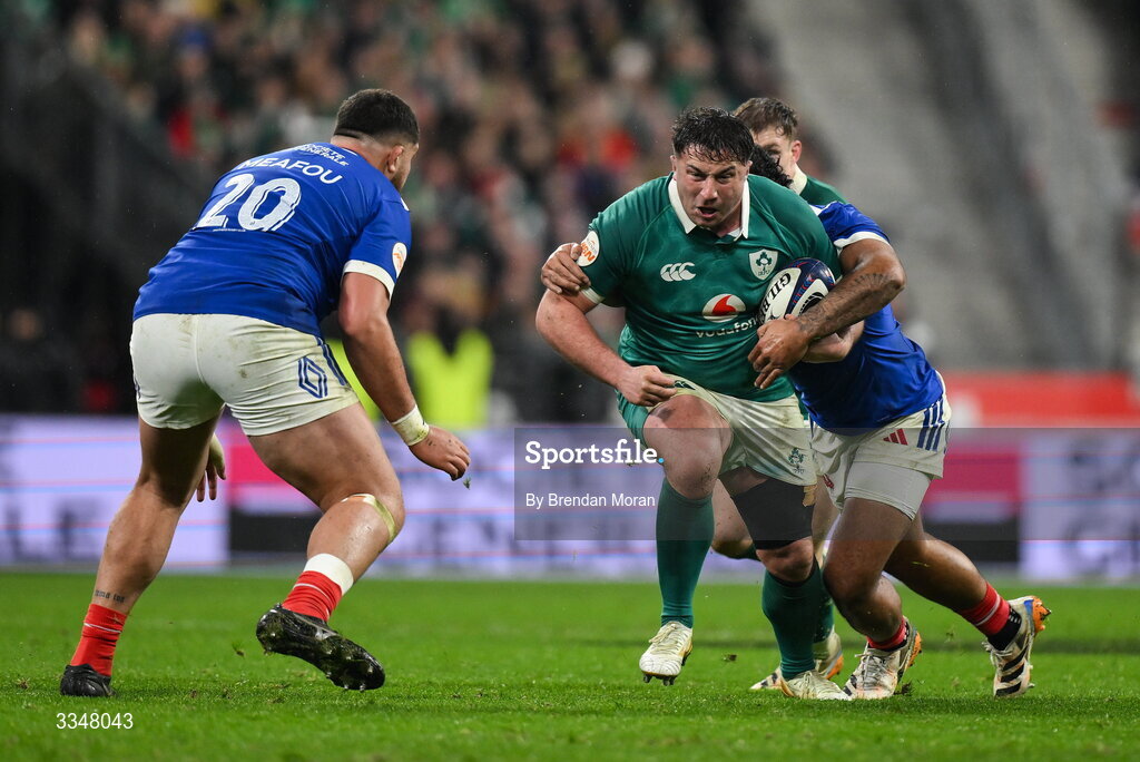5 February 2026; Thomas Clarkson of Ireland is tackled during the Guinness 6 Nations Rugby Championship match between France and Ireland at Stade de France in Paris, France. Photo by Brendan Moran/Sportsfile