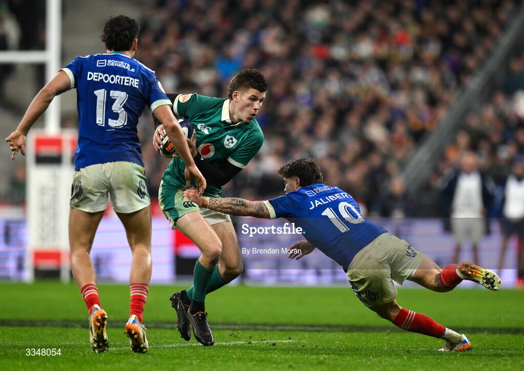 5 February 2026; Sam Prendergast of Ireland is tackled by Matthieu Jalibert of France during the Guinness 6 Nations Rugby Championship match between France and Ireland at Stade de France in Paris, France. Photo by Brendan Moran/Sportsfile
