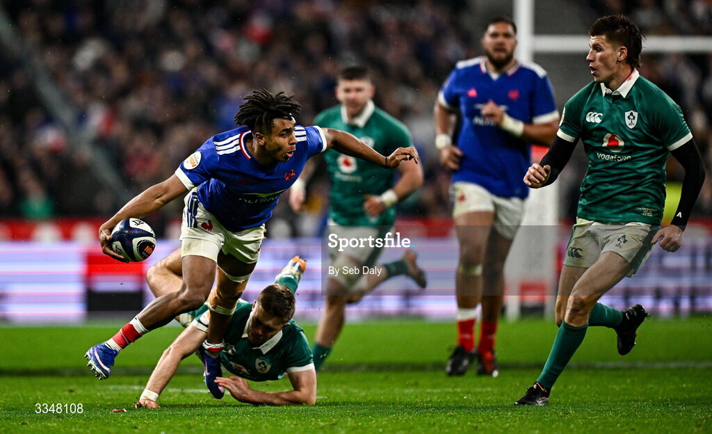 5 February 2026; Théo Attissogbe of France is tackled by Jack Crowley of Ireland during the Guinness 6 Nations Rugby Championship match between France and Ireland at Stade de France in Paris, France. Photo by Seb Daly/Sportsfile