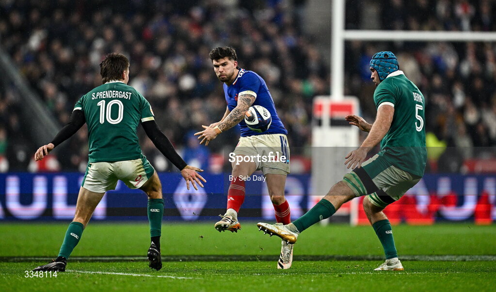 5 February 2026; Matthieu Jalibert of France in action against Ireland players Sam Prendergast, left, and Tadhg Beirne during the Guinness 6 Nations Rugby Championship match between France and Ireland at Stade de France in Paris, France. Photo by Seb Daly/Sportsfile