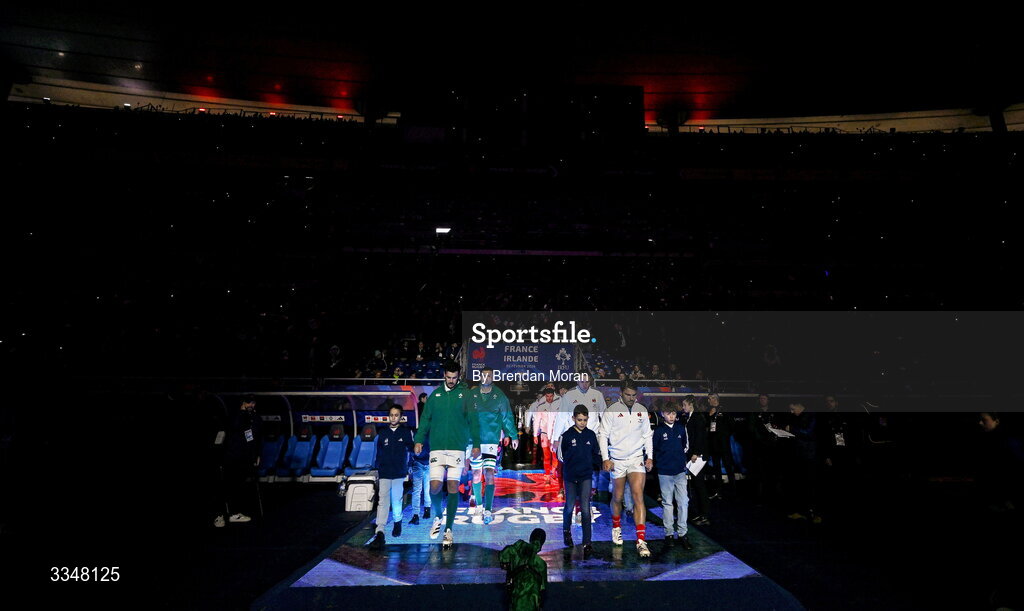 5 February 2026; Team captains Caelan Doris of Ireland, left, and Antoine Dupont of France lead their teams onto the pitch before the Guinness 6 Nations Rugby Championship match between France and Ireland at Stade de France in Paris, France. Photo by Brendan Moran/Sportsfile
