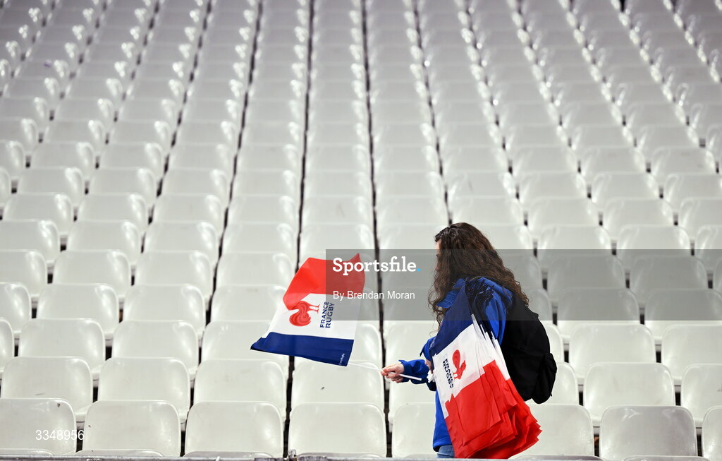 5 February 2026; A volunteer puts French flags in the seats before the Guinness 6 Nations Rugby Championship match between France and Ireland at Stade de France in Paris, France. Photo by Brendan Moran/Sportsfile