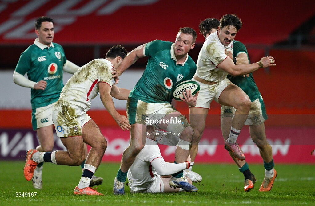 6 February 2026; Zac Ward of Ireland XV is tackled by Orlando Bailey, left, and George Hendy of England A during the representative fixture rugby union match between Ireland XV and England A at Thomond Park in Limerick. Photo by Ramsey Cardy/Sportsfile
