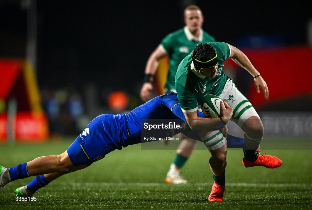 13 February 2026; Josh Neill of Ireland is tackled by Riccardo Casarin of Italy during the U20 Six Nations Rugby Championship match between Ireland and Italy at Virgin Media Park in Cork. Photo by Shauna Clinton/Sportsfile