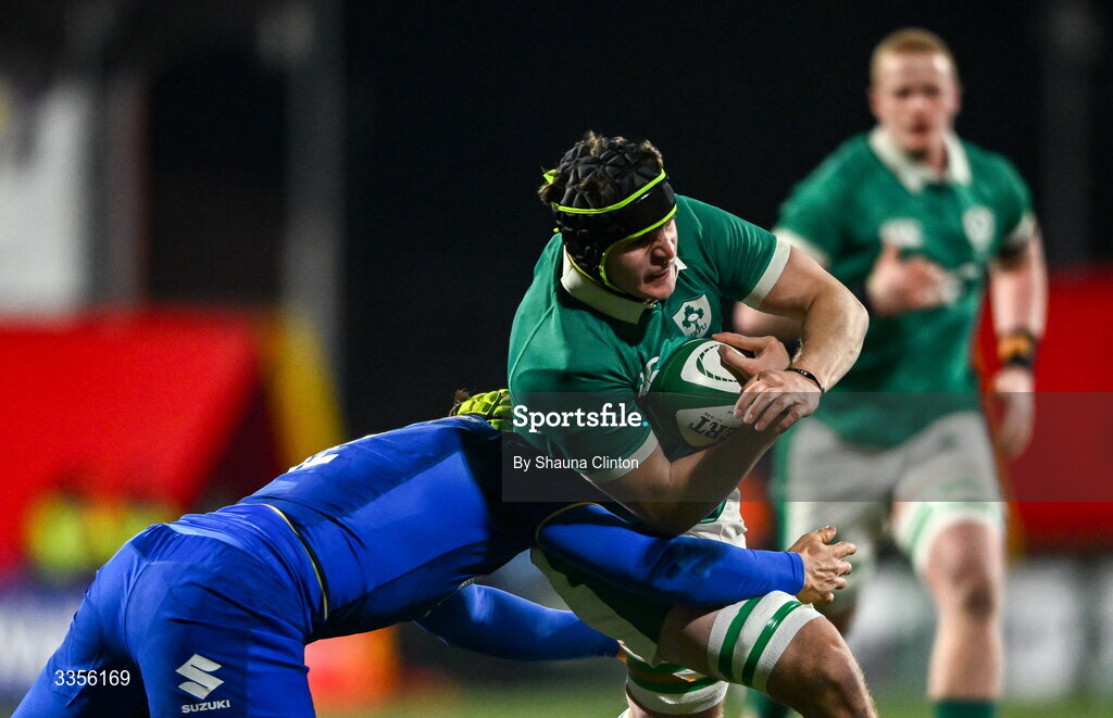 13 February 2026; Josh Neill of Ireland is tackled by Riccardo Casarin of Italy during the U20 Six Nations Rugby Championship match between Ireland and Italy at Virgin Media Park in Cork. Photo by Shauna Clinton/Sportsfile