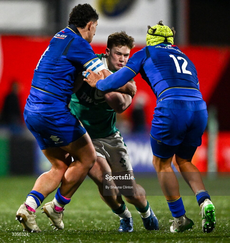 13 February 2026; James O'Leary of Ireland is tackled by Italy players Christian Brasini, left, and Riccardo Casarin during the U20 Six Nations Rugby Championship match between Ireland and Italy at Virgin Media Park in Cork. Photo by Shauna Clinton/Sportsfile