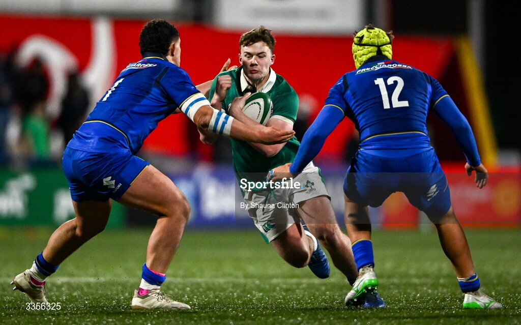 13 February 2026; James O'Leary of Ireland is tackled by Italy players Christian Brasini, left, and Riccardo Casarin during the U20 Six Nations Rugby Championship match between Ireland and Italy at Virgin Media Park in Cork. Photo by Shauna Clinton/Sportsfile