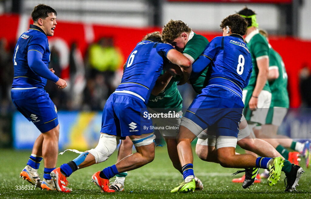 13 February 2026; Diarmaid O'Connell of Ireland is tackled by Italy players Antony Italo Miranda, left, and Davide Sette during the U20 Six Nations Rugby Championship match between Ireland and Italy at Virgin Media Park in Cork. Photo by Shauna Clinton/Sportsfile