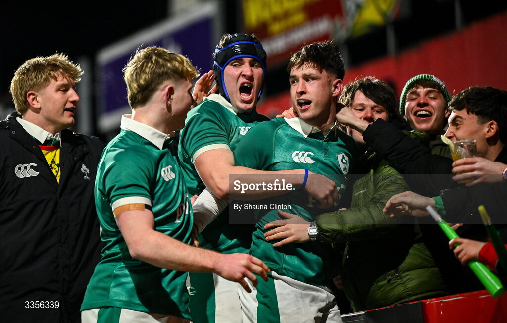 13 February 2026; Derry Moloney of Ireland, right, celebrates with team-mates and supporters after scoring his side's third try during the U20 Six Nations Rugby Championship match between Ireland and Italy at Virgin Media Park in Cork. Photo by Shauna Clinton/Sportsfile