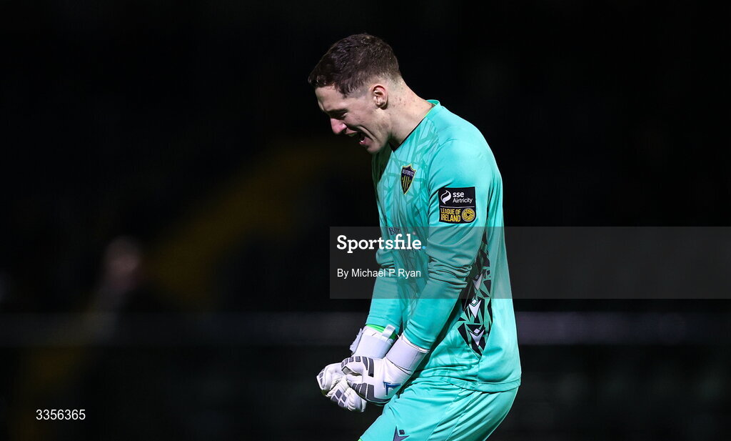 13 February 2026; Wexford goalkeeper Paul Martin celebrates his side's third goal scored by Jake Doyle, not pictured, during the SSE Airtricity Men's First Division match between Cobh Ramblers and Wexford at St Colman's Park in Cobh, Cork. Photo by Michael P Ryan/Sportsfile