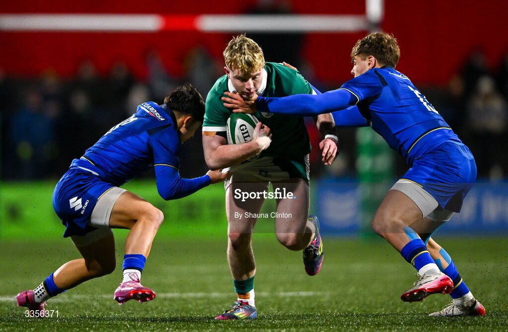 13 February 2026; Rob Carney of Ireland is tackled by Italy players Francesco Braga, left, and Daniele Coluzzi during the U20 Six Nations Rugby Championship match between Ireland and Italy at Virgin Media Park in Cork. Photo by Shauna Clinton/Sportsfile