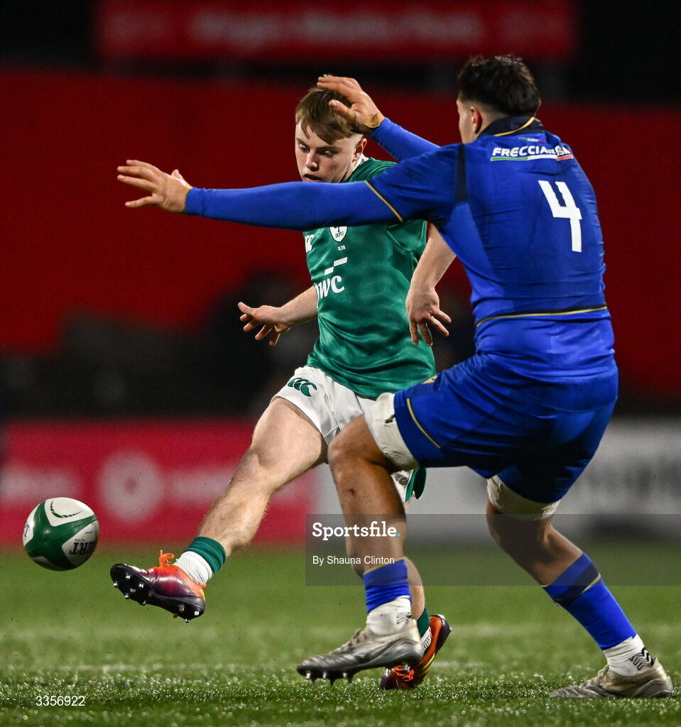 13 February 2026; Charlie O'Shea of Ireland kicks on despite the attention of Simone Fardin of Italy during the U20 Six Nations Rugby Championship match between Ireland and Italy at Virgin Media Park in Cork. Photo by Shauna Clinton/Sportsfile