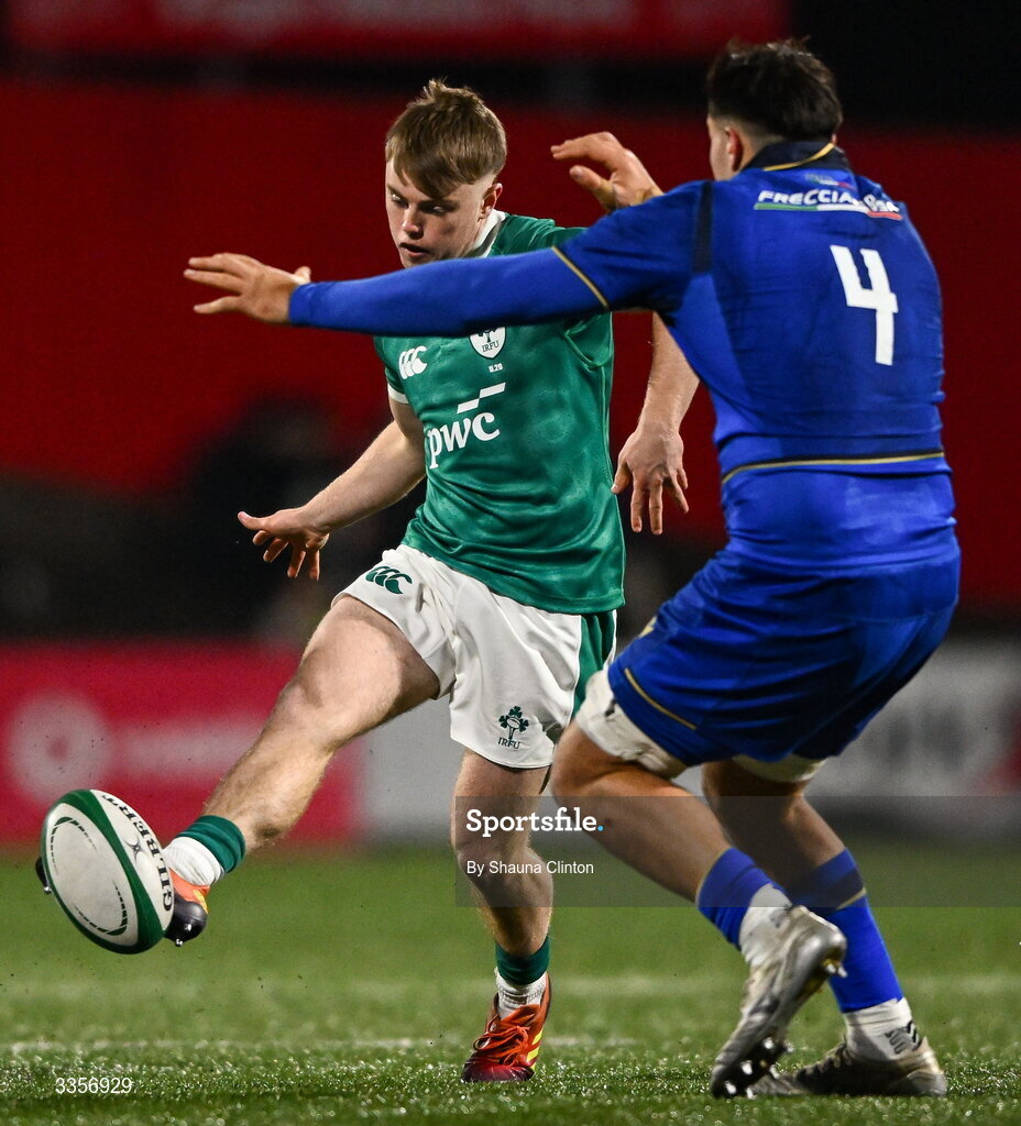 13 February 2026; Charlie O'Shea of Ireland kicks on despite the attention of Simone Fardin of Italy during the U20 Six Nations Rugby Championship match between Ireland and Italy at Virgin Media Park in Cork. Photo by Shauna Clinton/Sportsfile