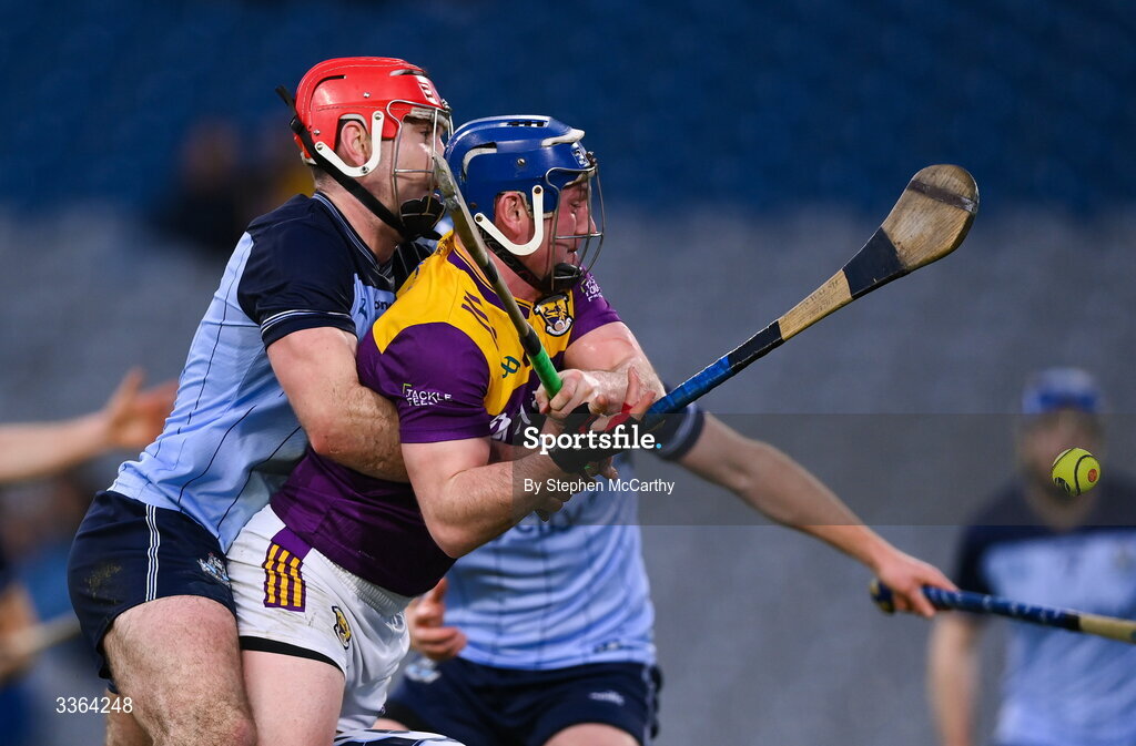 21 February 2026; Kevin Foley of Wexford shoots to score his side's first goal despite the attention of Paddy Smyth of Dublin during the Allianz Hurling League Division 1B match between Dublin and Wexford at Croke Park in Dublin. Photo by Stephen McCarthy/Sportsfile