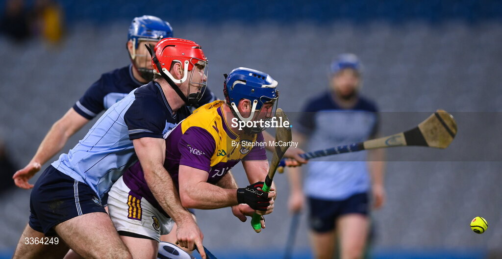 21 February 2026; Kevin Foley of Wexford shoots to score his side's first goal despite the attention of Paddy Smyth of Dublin during the Allianz Hurling League Division 1B match between Dublin and Wexford at Croke Park in Dublin. Photo by Stephen McCarthy/Sportsfile