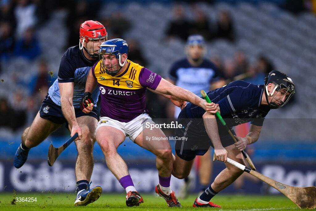 21 February 2026; Kevin Foley of Wexford in action against Paddy Smyth, left, and Seán Brennan of Dublin during the Allianz Hurling League Division 1B match between Dublin and Wexford at Croke Park in Dublin. Photo by Stephen McCarthy/Sportsfile