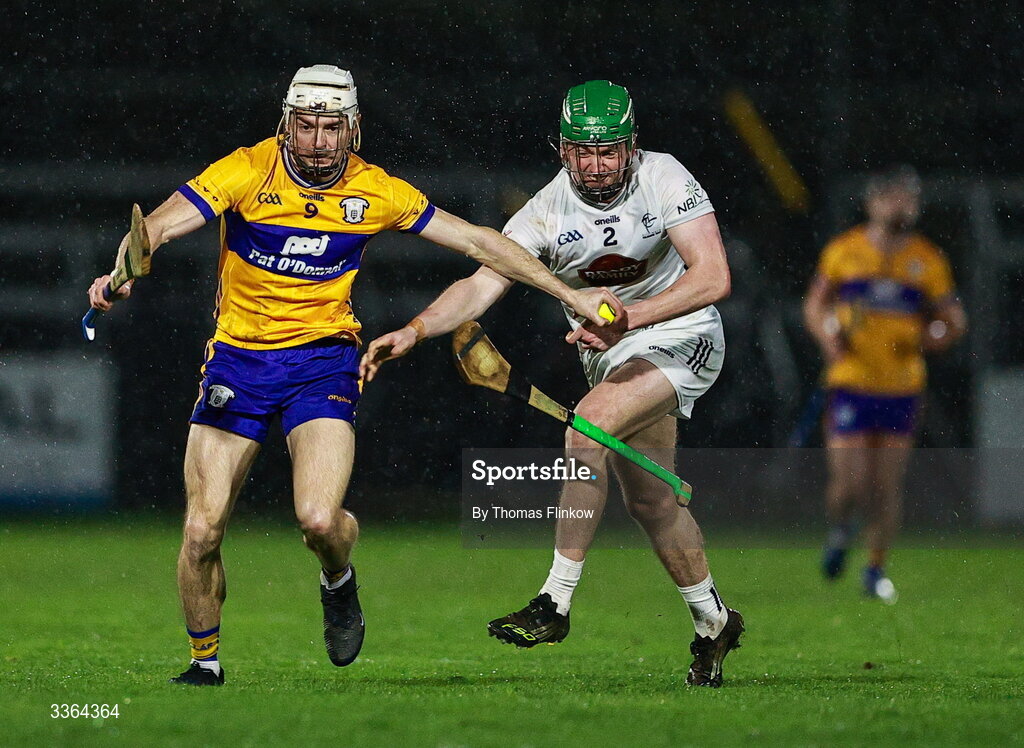 21 February 2026; Ryan Taylor of Clare in action against Liam O'Reilly of Kildare during the Allianz Hurling League Division 1B match between Kildare and Clare at Cedral St Conleth's Park in Newbridge, Kildare. Photo by Thomas Flinkow/Sportsfile