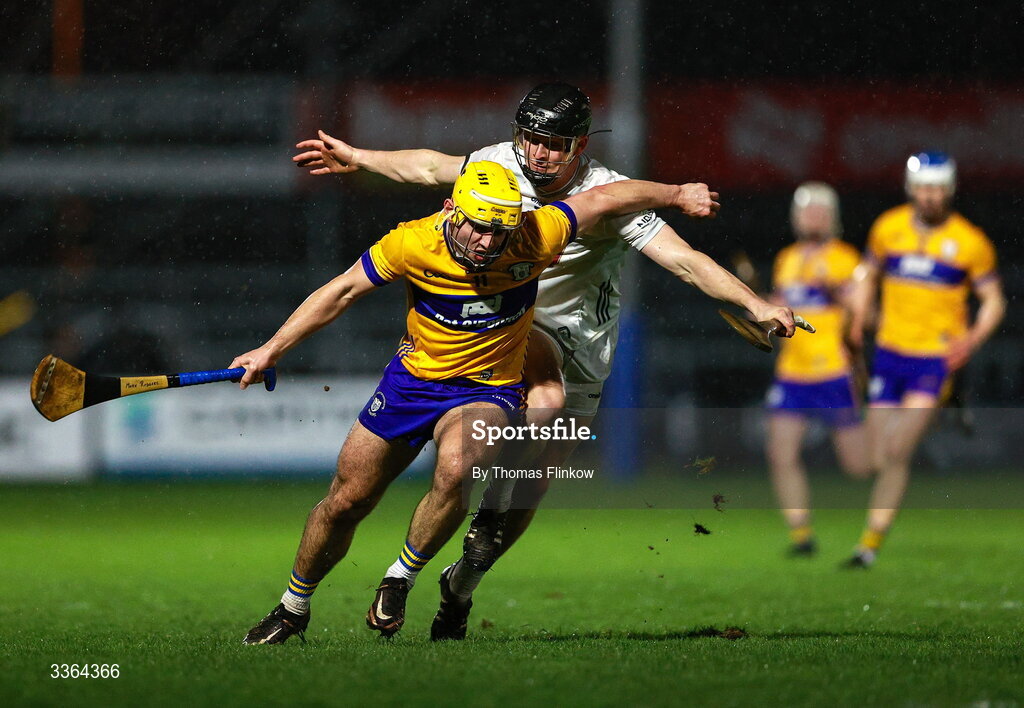 21 February 2026; Mark Rodgers of Clare in action against Rian Boran of Kildare during the Allianz Hurling League Division 1B match between Kildare and Clare at Cedral St Conleth's Park in Newbridge, Kildare. Photo by Thomas Flinkow/Sportsfile