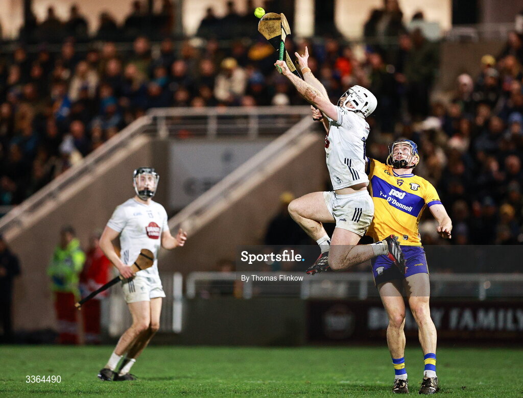 21 February 2026; Muiris Curtin of Kildare in action against David McInerney of Clare during the Allianz Hurling League Division 1B match between Kildare and Clare at Cedral St Conleth's Park in Newbridge, Kildare. Photo by Thomas Flinkow/Sportsfile