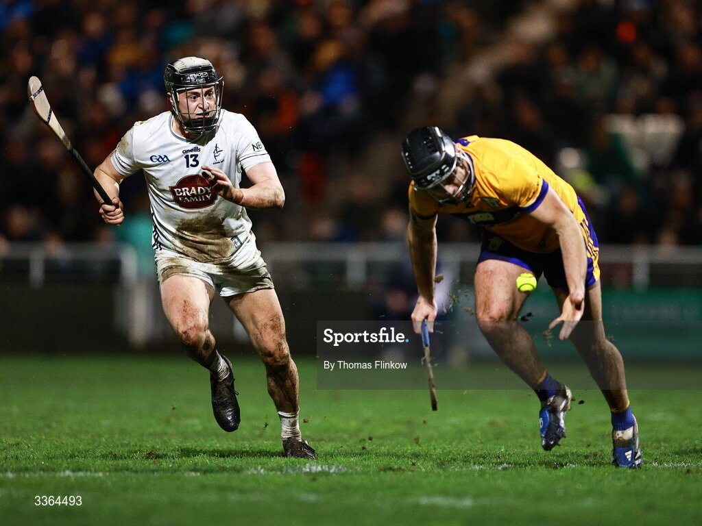 21 February 2026; David Qualter of Kildare in action against Dylan McMahon of Clare during the Allianz Hurling League Division 1B match between Kildare and Clare at Cedral St Conleth's Park in Newbridge, Kildare. Photo by Thomas Flinkow/Sportsfile