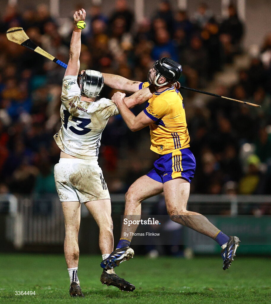 21 February 2026; David Qualter of Kildare in action against Dylan McMahon of Clare during the Allianz Hurling League Division 1B match between Kildare and Clare at Cedral St Conleth's Park in Newbridge, Kildare. Photo by Thomas Flinkow/Sportsfile