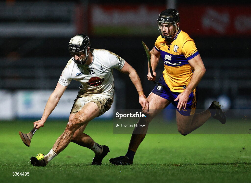 21 February 2026; David Qualter of Kildare in action against Dylan McMahon of Clare during the Allianz Hurling League Division 1B match between Kildare and Clare at Cedral St Conleth's Park in Newbridge, Kildare. Photo by Thomas Flinkow/Sportsfile