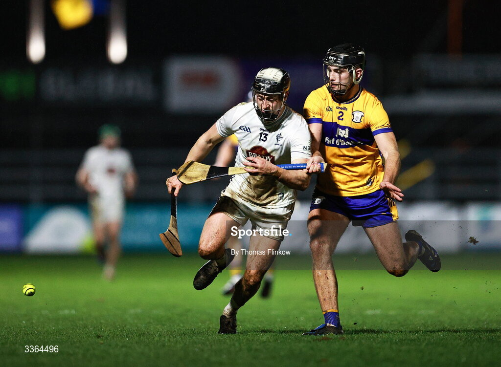 21 February 2026; David Qualter of Kildare in action against Dylan McMahon of Clare during the Allianz Hurling League Division 1B match between Kildare and Clare at Cedral St Conleth's Park in Newbridge, Kildare. Photo by Thomas Flinkow/Sportsfile