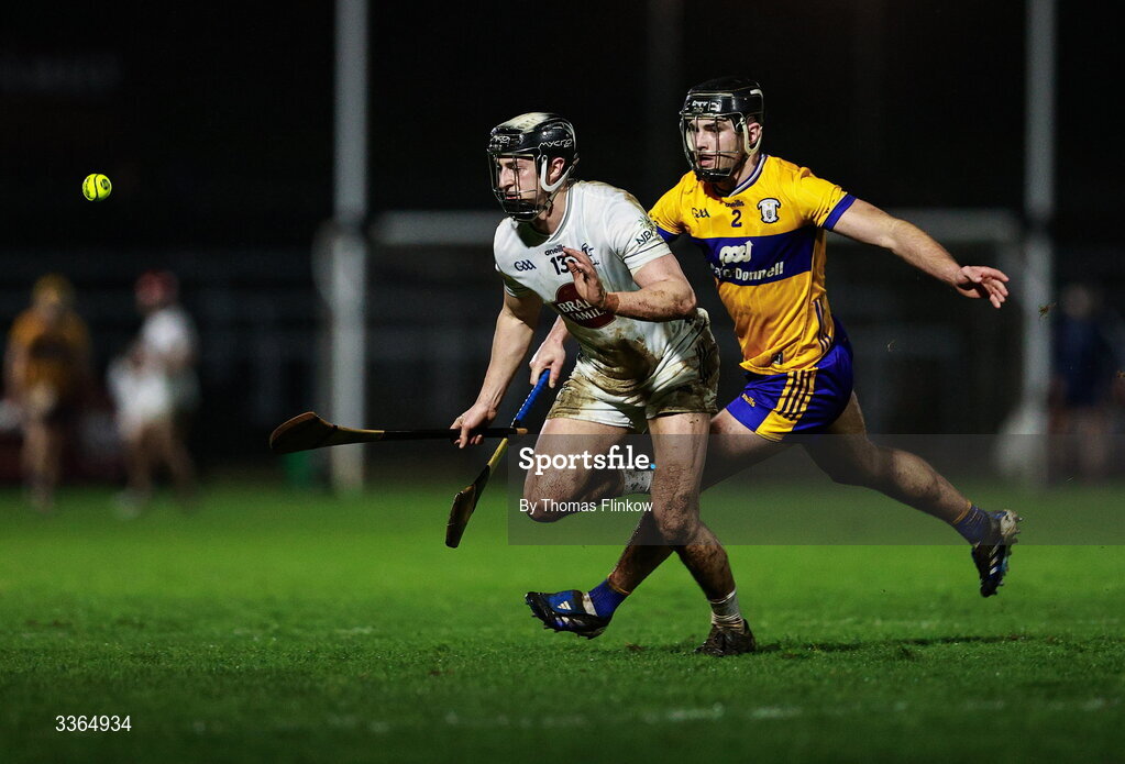 21 February 2026; David Qualter of Kildare in action against Dylan McMahon of Clare during the Allianz Hurling League Division 1B match between Kildare and Clare at Cedral St Conleth's Park in Newbridge, Kildare. Photo by Thomas Flinkow/Sportsfile