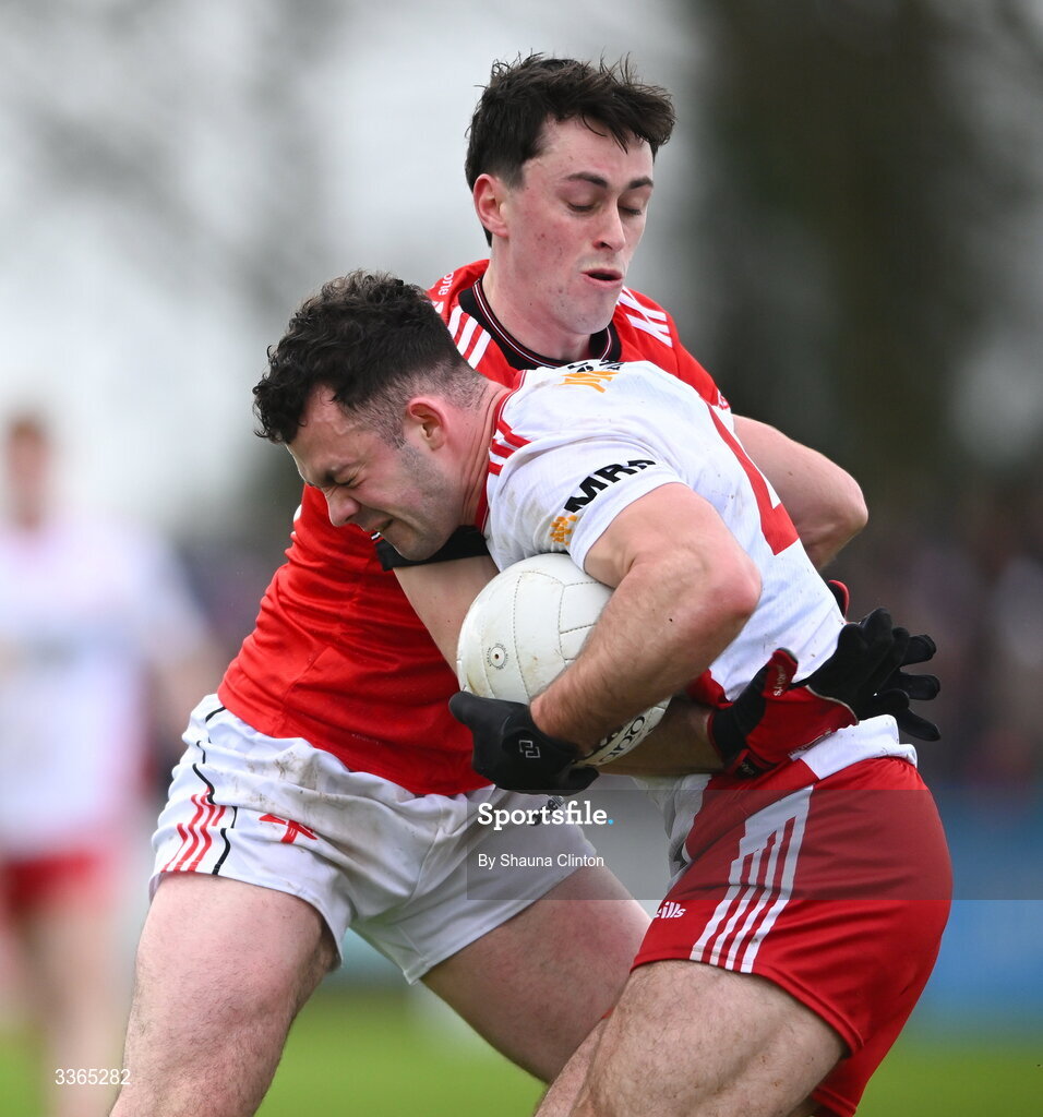 22 February 2026; Michael Rafferty of Tyrone is tackled by Kieran McArdle of Louth during the Allianz Football League Division 2 match between Louth and Tyrone at DEFY Pairc Mhuire in Ardee, Louth. Photo by Shauna Clinton/Sportsfile