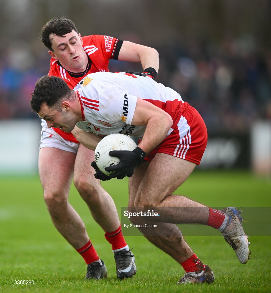 22 February 2026; Michael Rafferty of Tyrone is tackled by Kieran McArdle of Louth during the Allianz Football League Division 2 match between Louth and Tyrone at DEFY Pairc Mhuire in Ardee, Louth. Photo by Shauna Clinton/Sportsfile