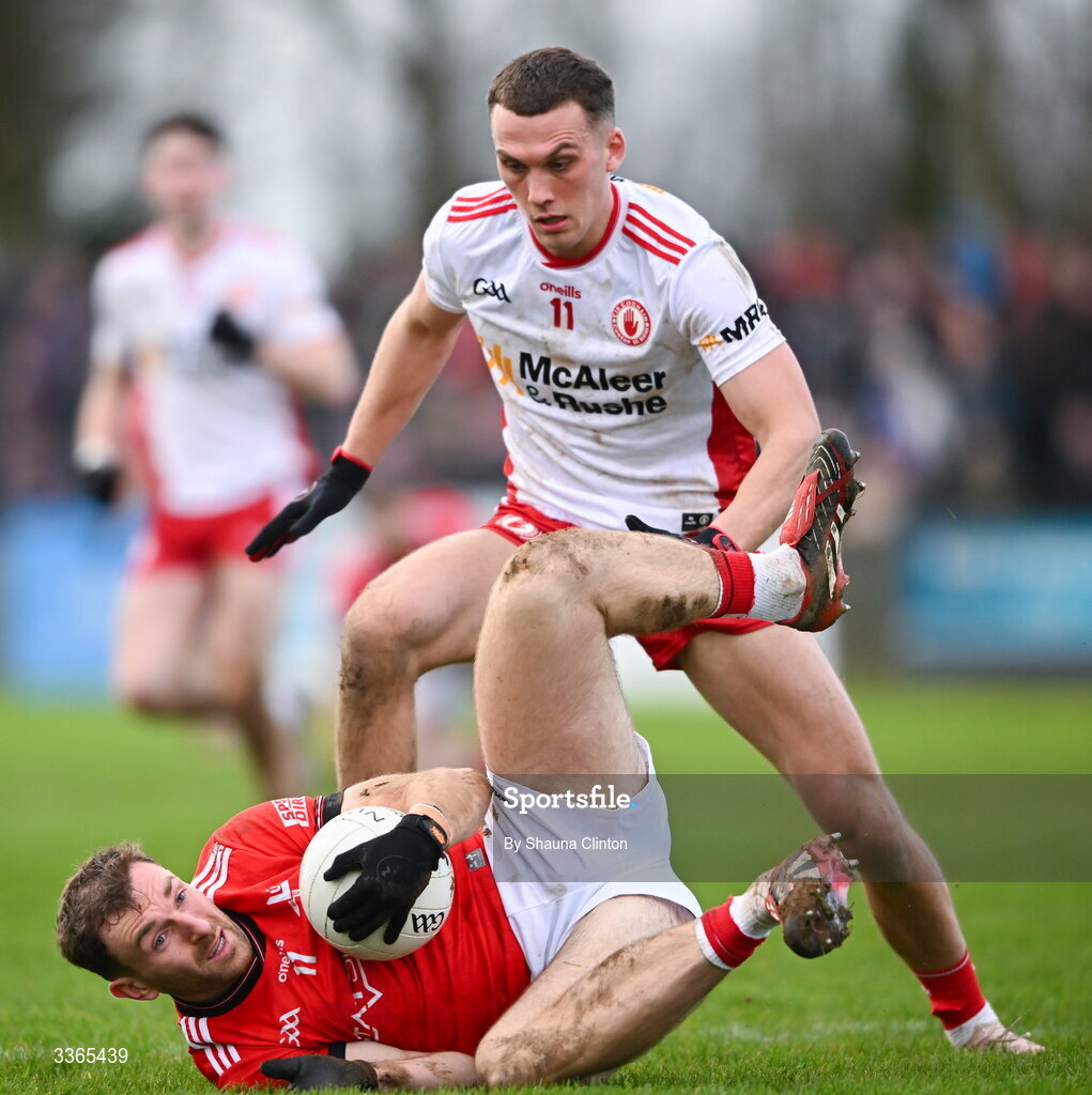 22 February 2026; Conn Fitzpatrick of Tyrone tackles Sam Mulroy of Louth during the Allianz Football League Division 2 match between Louth and Tyrone at DEFY Pairc Mhuire in Ardee, Louth. Photo by Shauna Clinton/Sportsfile