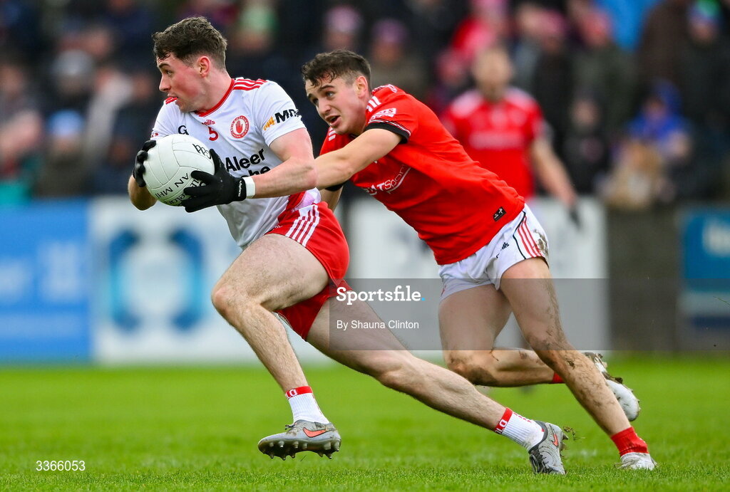 22 February 2026; Aidan Clarke of Tyrone is tackled by Conor Early of Louth during the Allianz Football League Division 2 match between Louth and Tyrone at DEFY Pairc Mhuire in Ardee, Louth. Photo by Shauna Clinton/Sportsfile