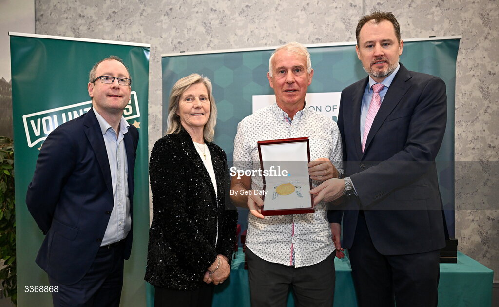 26 February 2026; Declan Harte of NAC Masters SC, Dublin Fingal, is presented with his award by Minister of State at the Department of Culture, Communications and Sport Charlie McConalogue TD, Federation of Irish Sport chair Clare McGrath, and Dun Laoghaire Rathdown Sports Partnership coordinator Shane McArdle, during the Volunteers in Sport Awards 2025, hosted by the Federation of Irish Sport and supported by the National Network of 29 Local Sports Partnerships, at The Crowne Plaza Hotel in Blanchardstown, Dublin. Photo by Seb Daly/Sportsfile