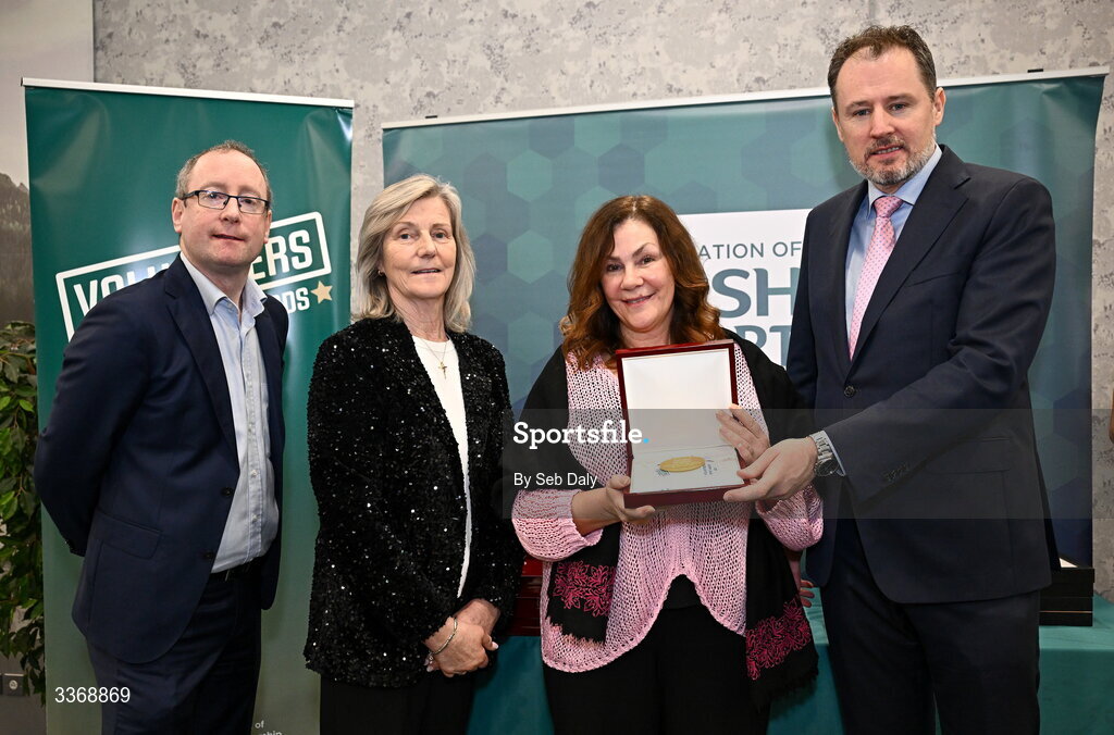 26 February 2026; Patsy Kelleher of Dublin Lions Basketball Club, Dublin South County, is presented with her award by Minister of State at the Department of Culture, Communications and Sport Charlie McConalogue TD, Federation of Irish Sport chair Clare McGrath, and Dun Laoghaire Rathdown Sports Partnership coordinator Shane McArdle, during the Volunteers in Sport Awards 2025, hosted by the Federation of Irish Sport and supported by the National Network of 29 Local Sports Partnerships, at The Crowne Plaza Hotel in Blanchardstown, Dublin. Photo by Seb Daly/Sportsfile