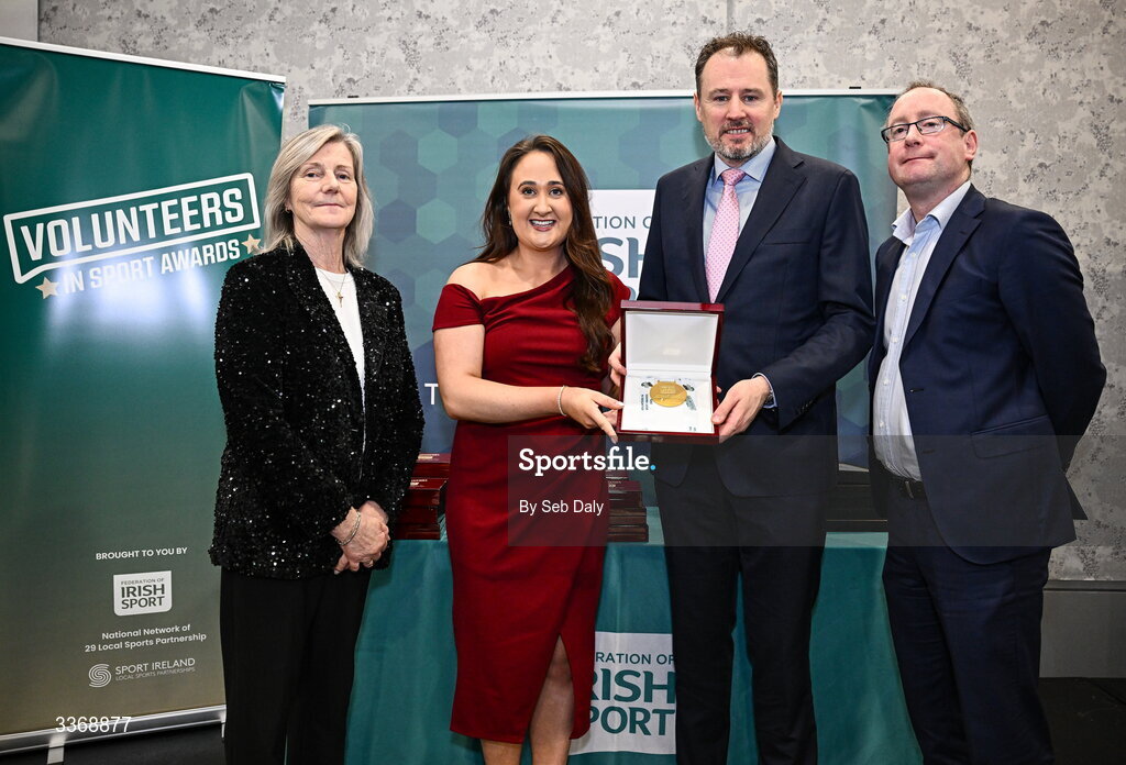 26 February 2026; Kelly Fitzgerald of Owenabue Special Olympics Gymnastics, Cork, is presented with her award by Minister of State at the Department of Culture, Communications and Sport Charlie McConalogue TD, Federation of Irish Sport chair Clare McGrath, and Dun Laoghaire Rathdown Sports Partnership coordinator Shane McArdle, during the Volunteers in Sport Awards 2025, hosted by the Federation of Irish Sport and supported by the National Network of 29 Local Sports Partnerships, at The Crowne Plaza Hotel in Blanchardstown, Dublin. Photo by Seb Daly/Sportsfile