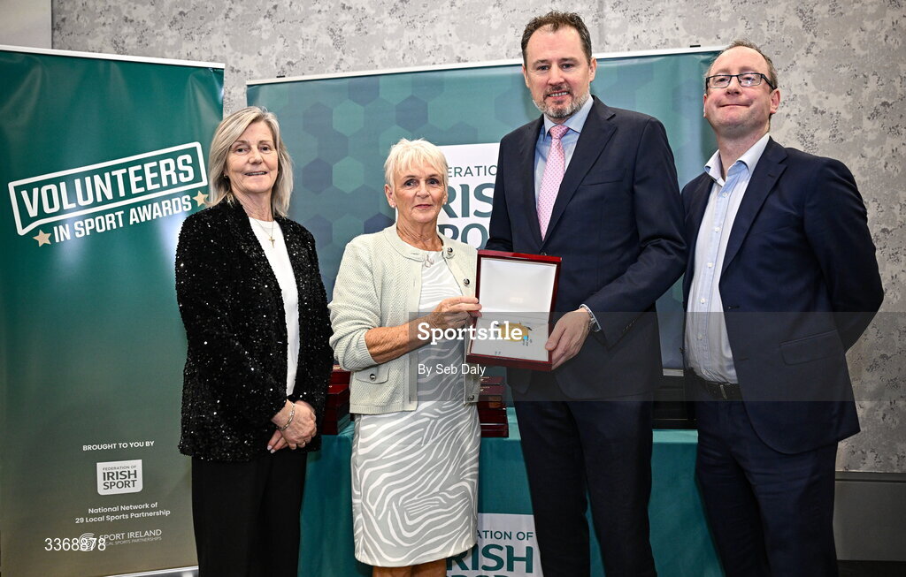 26 February 2026; Debbie Quirke of Kingdom Pickleball Club, Kerry, is presented with her award by Minister of State at the Department of Culture, Communications and Sport Charlie McConalogue TD, Federation of Irish Sport chair Clare McGrath, and Dun Laoghaire Rathdown Sports Partnership coordinator Shane McArdle, during the Volunteers in Sport Awards 2025, hosted by the Federation of Irish Sport and supported by the National Network of 29 Local Sports Partnerships, at The Crowne Plaza Hotel in Blanchardstown, Dublin. Photo by Seb Daly/Sportsfile