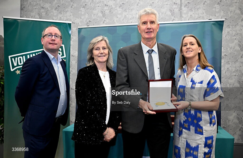 26 February 2026; John Joe Doyle of DMP Athletics Club , Wexford, is presented with his award by Federation of Irish Sport chief executive officer Mary O'Connor, Federation of Irish Sport chair Clare McGrath, and Dun Laoghaire Rathdown Sports Partnership coordinator Shane McArdle, during the Volunteers in Sport Awards 2025, hosted by the Federation of Irish Sport and supported by the National Network of 29 Local Sports Partnerships, at The Crowne Plaza Hotel in Blanchardstown, Dublin. Photo by Seb Daly/Sportsfile