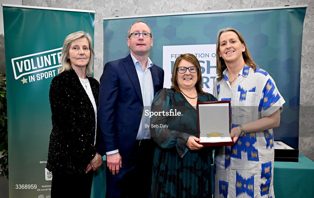 26 February 2026; Majella Crilly of St Brenda’s Camogie Club, Armagh, is presented with her award by Federation of Irish Sport chief executive officer Mary O'Connor, Federation of Irish Sport chair Clare McGrath, and Dun Laoghaire Rathdown Sports Partnership coordinator Shane McArdle, during the Volunteers in Sport Awards 2025, hosted by the Federation of Irish Sport and supported by the National Network of 29 Local Sports Partnerships, at The Crowne Plaza Hotel in Blanchardstown, Dublin. Photo by Seb Daly/Sportsfile